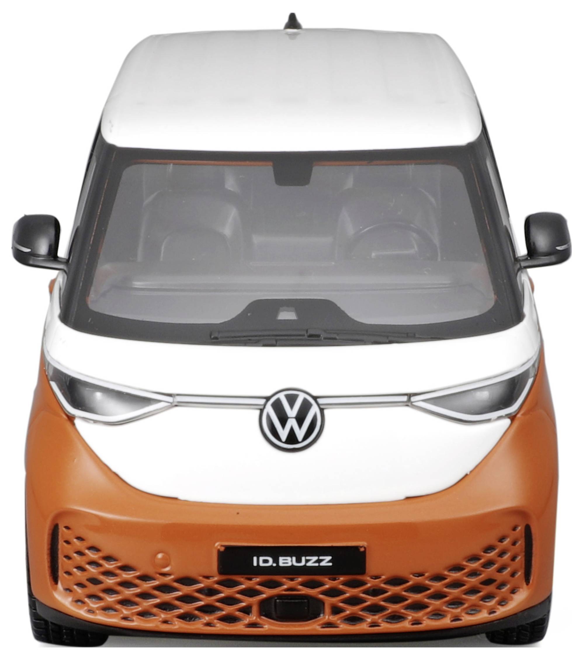 Compact orange and white VW ID. Buzz, viewed from the front. Electric minibus with distinctive VW logo and modern design.