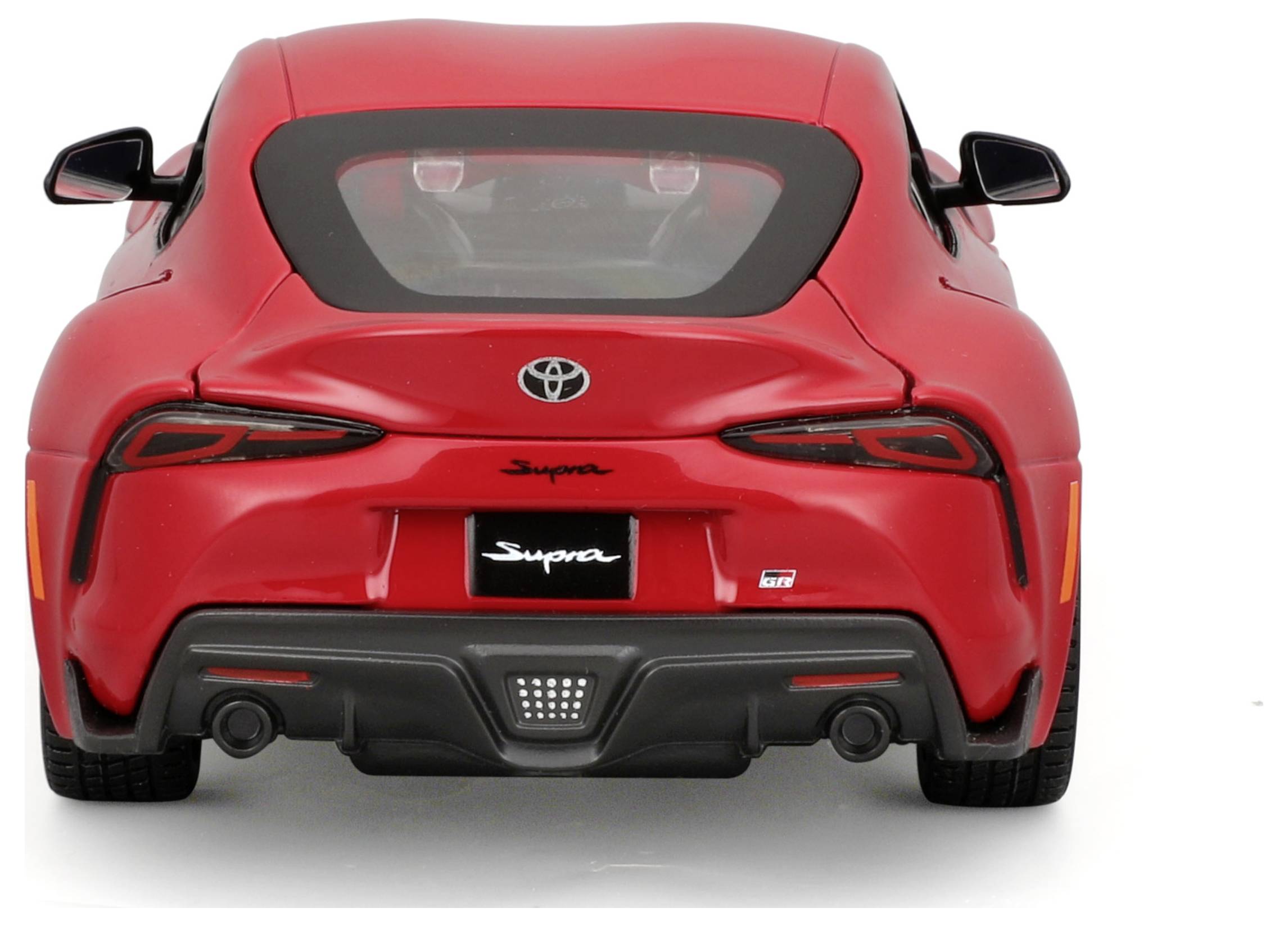 Red sports car from behind, with distinctive rear lights and 'Supra' logo.