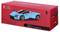 Model car packaging of a blue Ferrari Daytona SP3, illustration of the car on a red background. Marked for age 14+.