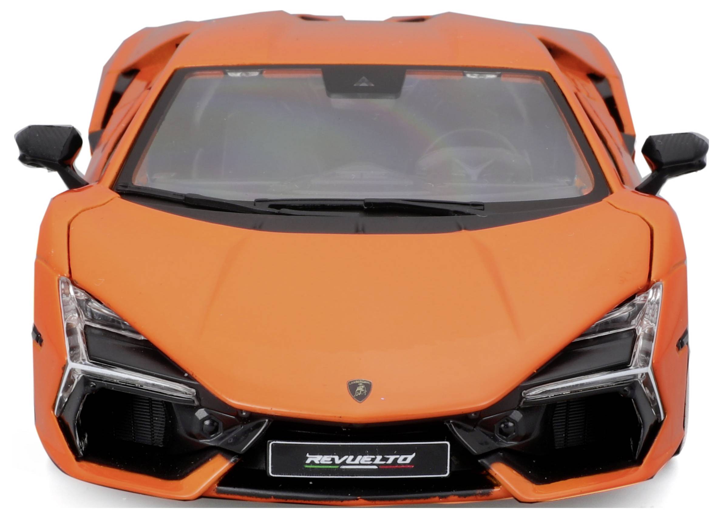 An orange sports car from the front, featuring distinctive lines and an aggressive design. In the centre beneath the bonnet, 'Revueltó' is written.