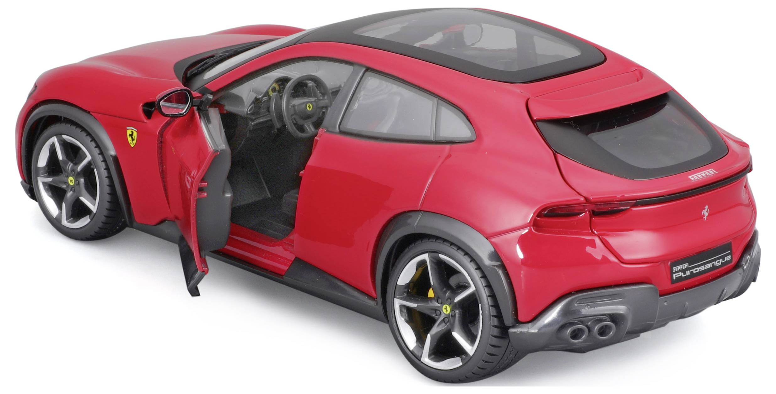 A red model car with an open driver's door, black roof and wheels. Ferrari logo visible, sporting design.