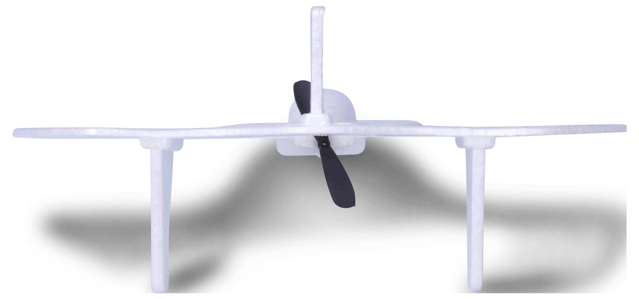 A simple foam model aeroplane with a propeller and two long horns on a white background, with a shadow underneath.