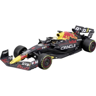 A black Formula 1 racing car with red and yellow accents from Red Bull Racing, sponsor logos visible, against a light background.
