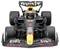 A black Formula 1 racing car with red and yellow accents on a black background. The car is positioned facing forward.