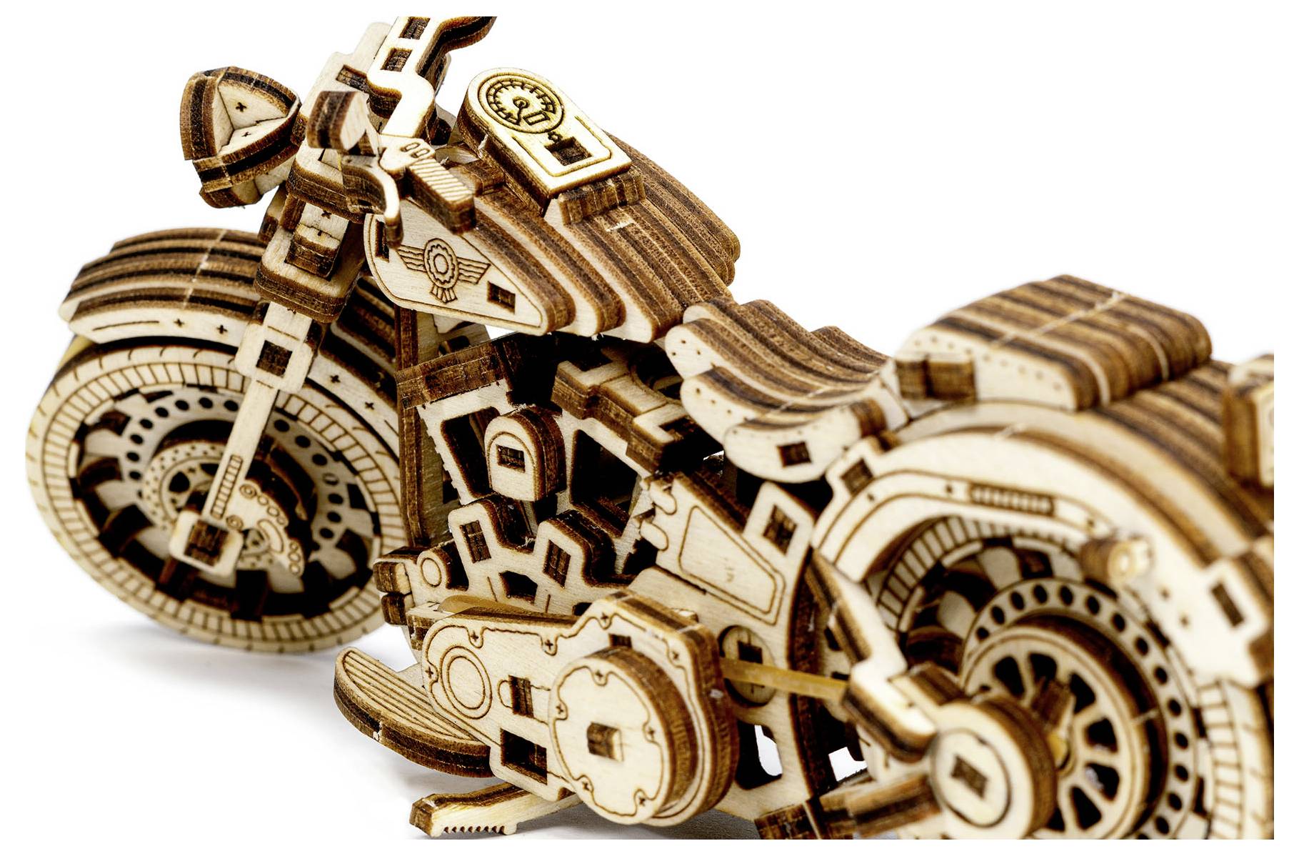 Wooden model of a motorcycle kit with detailed parts such as wheels, engine and saddle, showcasing craftsmanship and precision.