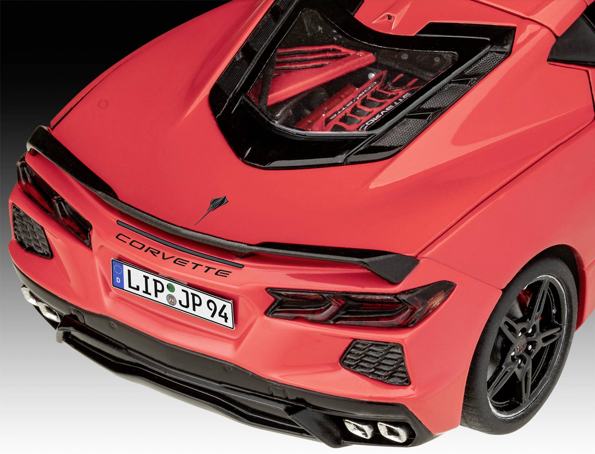 Red sports car from a bird's-eye view, with the 'Corvette' lettering and German number plate 'LIP-JP94'. Vehicle in focus.