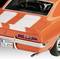 An orange classic car with white stripes and a German number plate. Rear view of the car against a grey background.