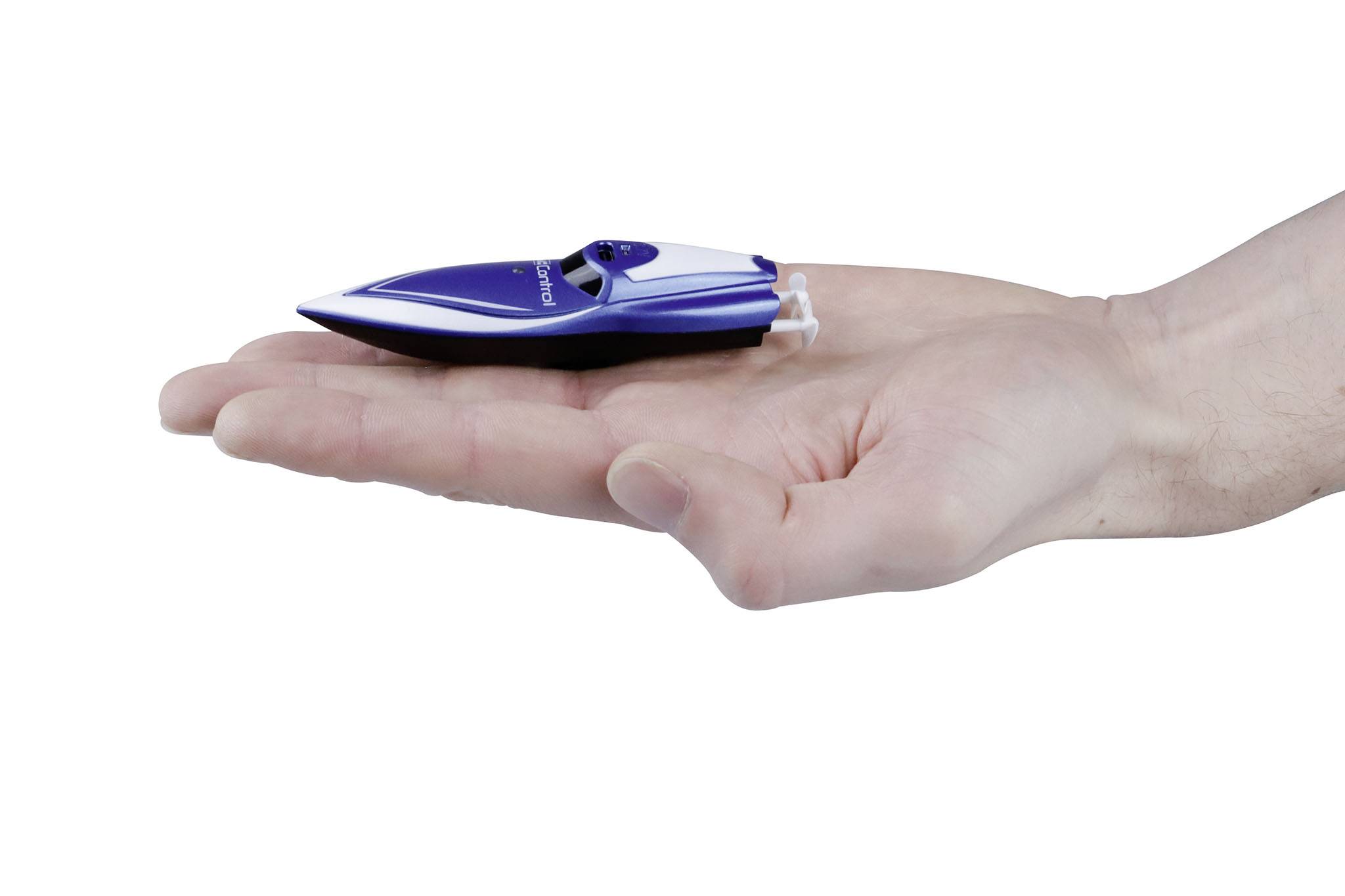 A hand holds a small, blue-and-white model boat, visualising the difference in scale.