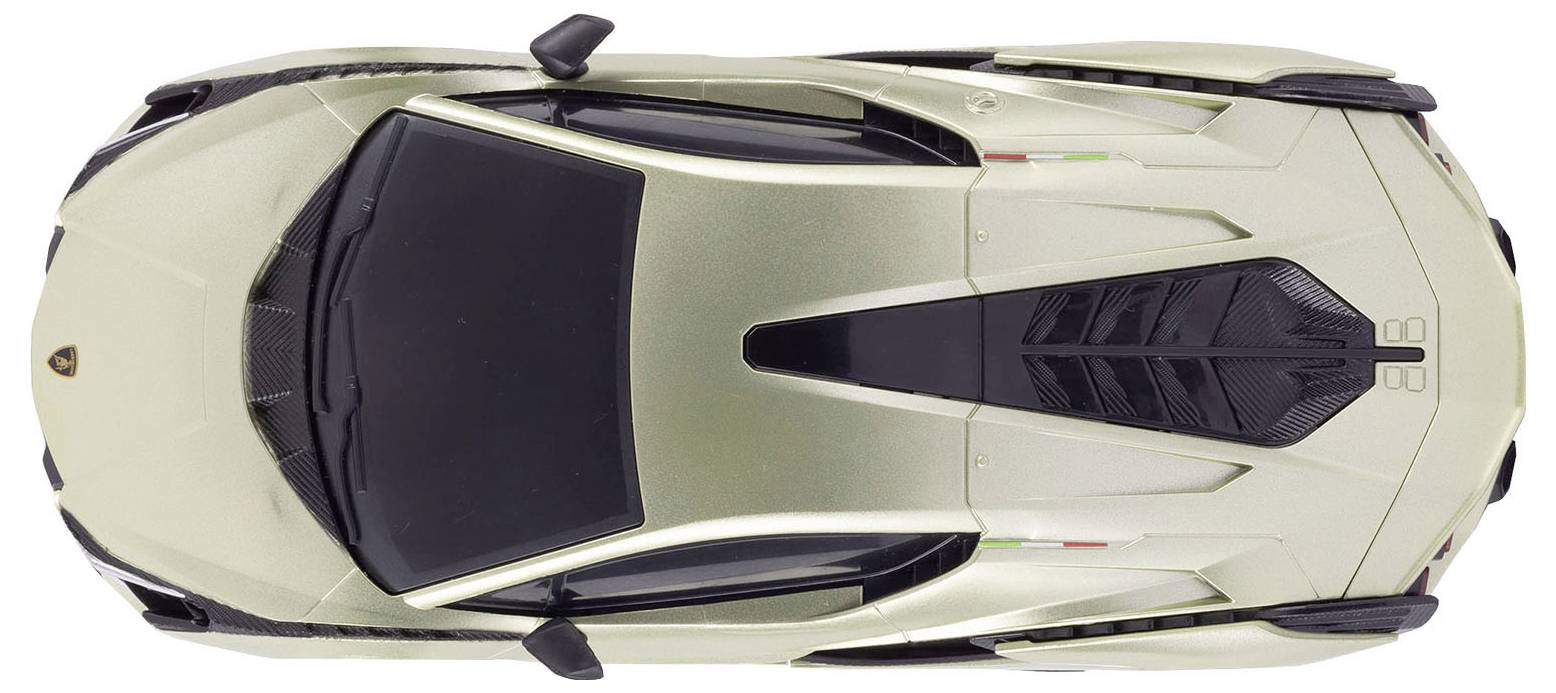 Top-down view of a beige sports car, likely a model car, against a white background. Elegantly designed bodywork and details visible.