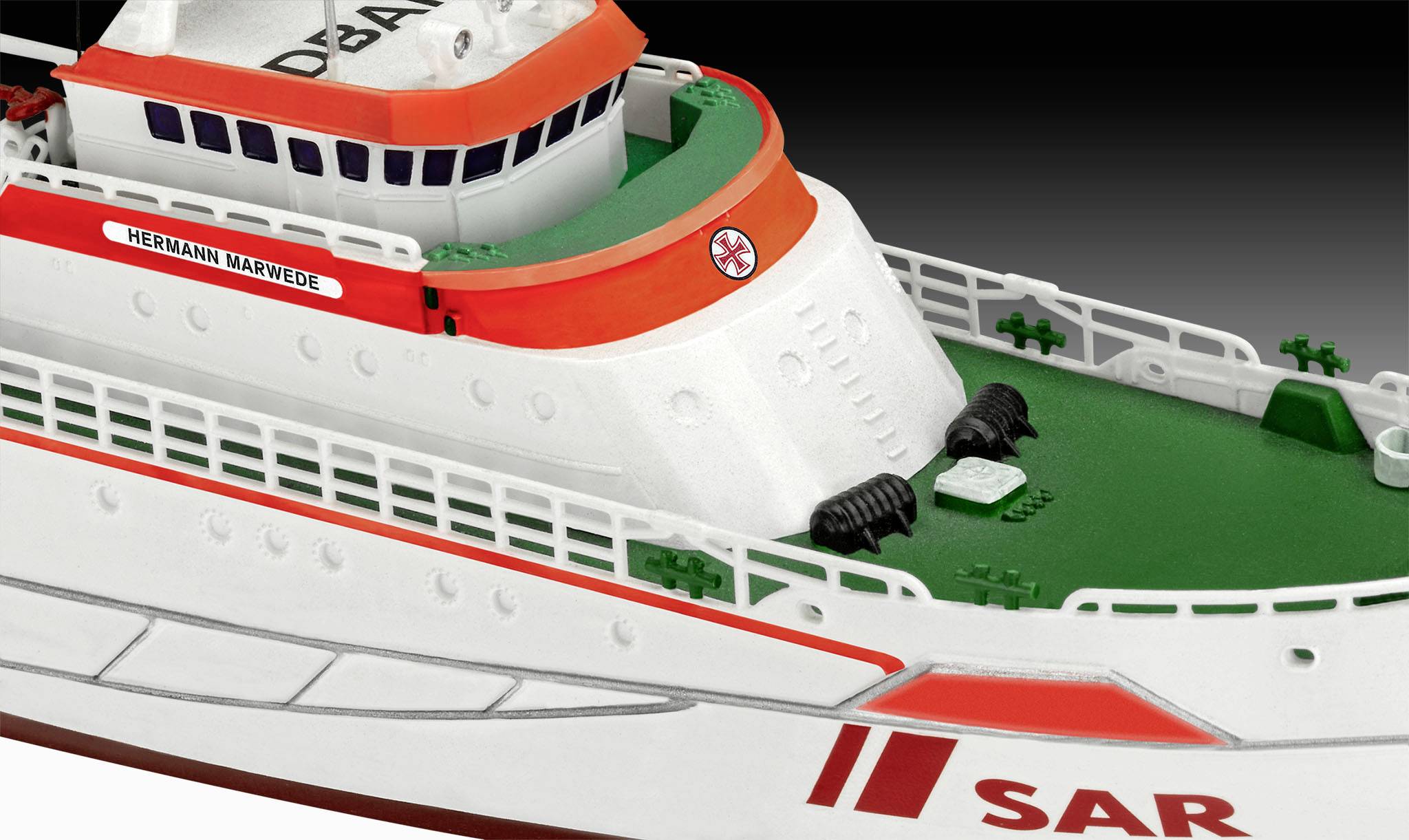 Rescue boat model with white and orange details, inscription 'HERMANN MARWEDE'. Deck is painted green with SAR marking.