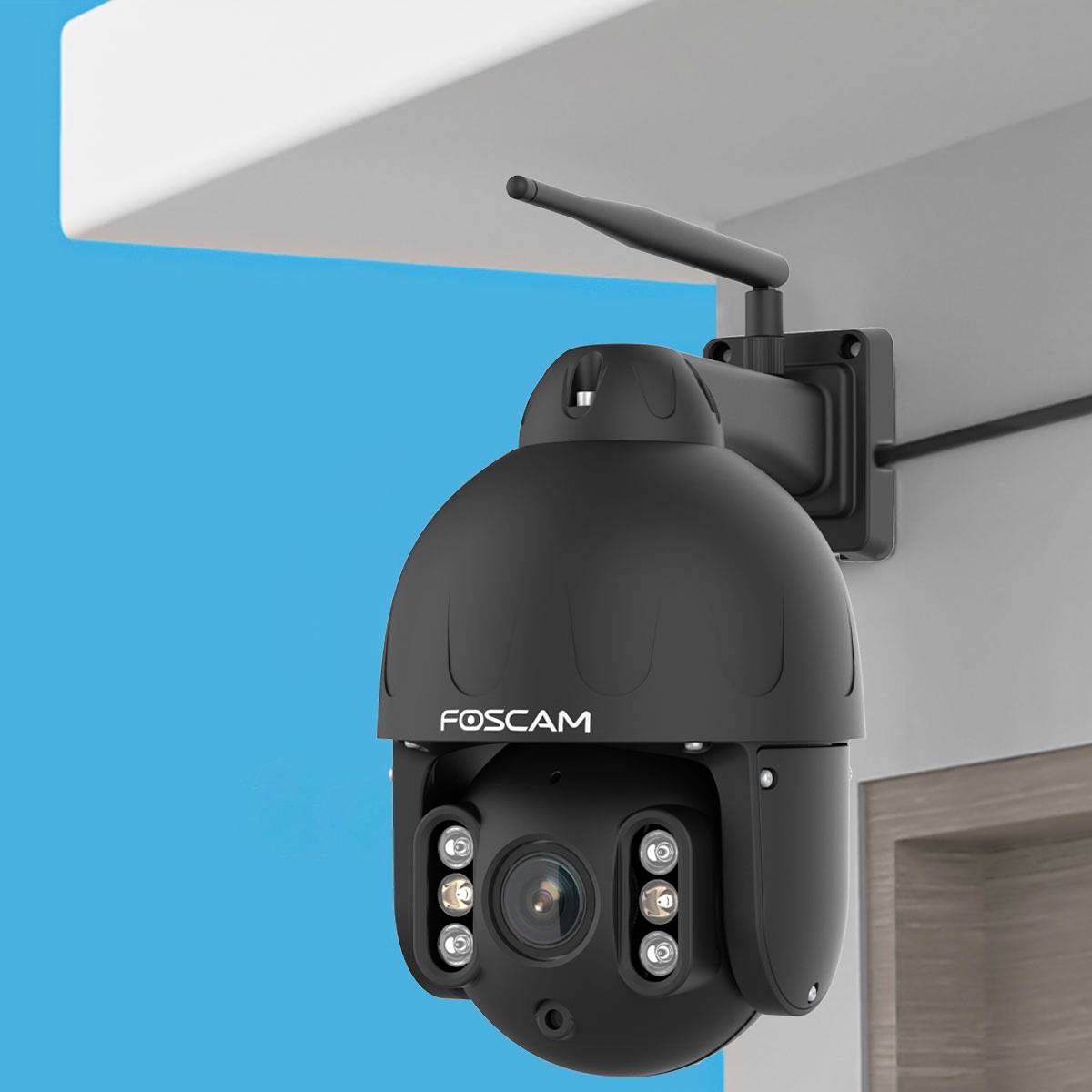 Surveillance camera mounted on a ceiling, pointing downwards. The background is blue.