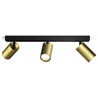Three golden spotlights on a black mounting, two pointing downwards and one positioned sideways. Ideal for modern interior lighting.