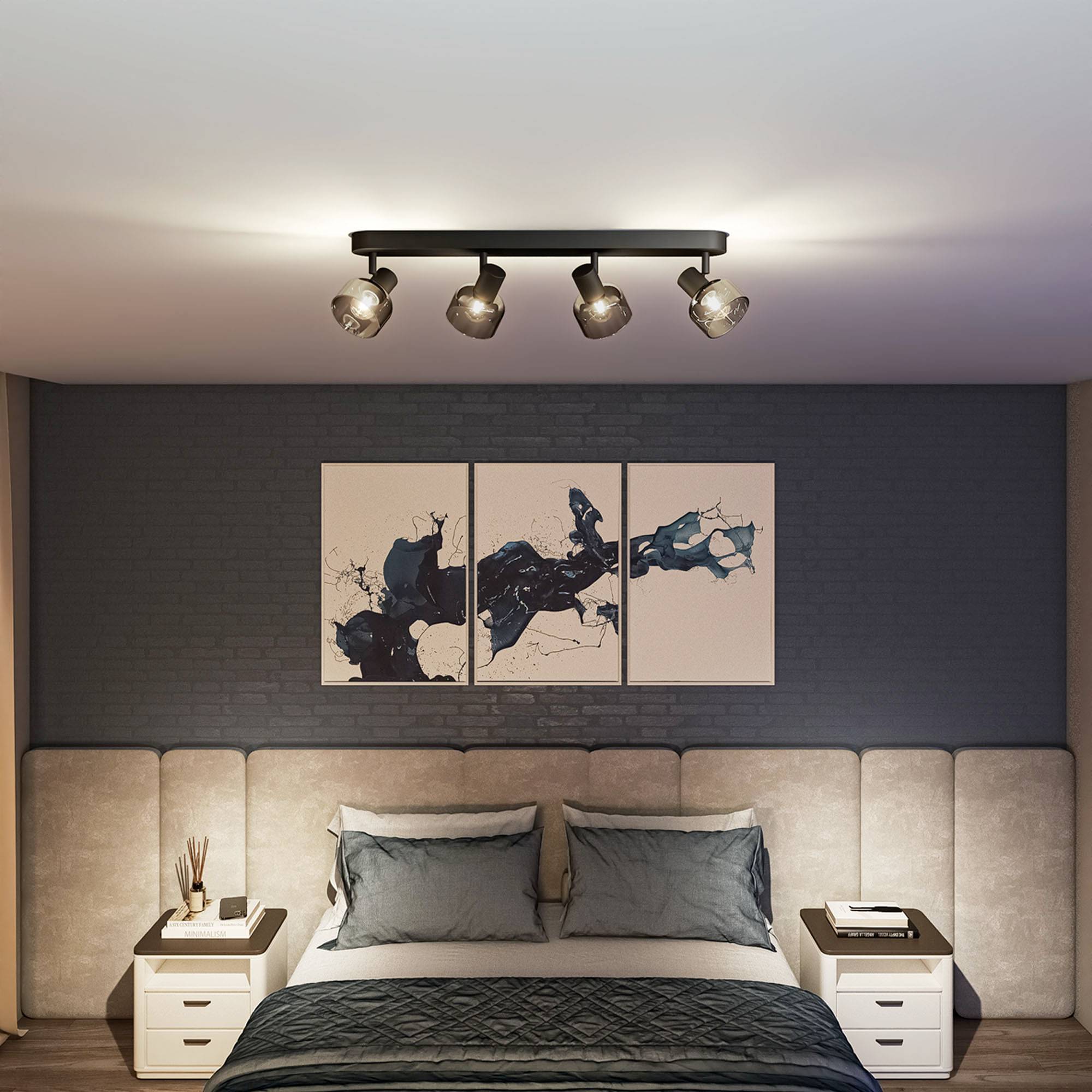 Bedroom with a double bed, blue cushions, beige upholstered headboard and a modern ceiling light. Wall art above the bed.