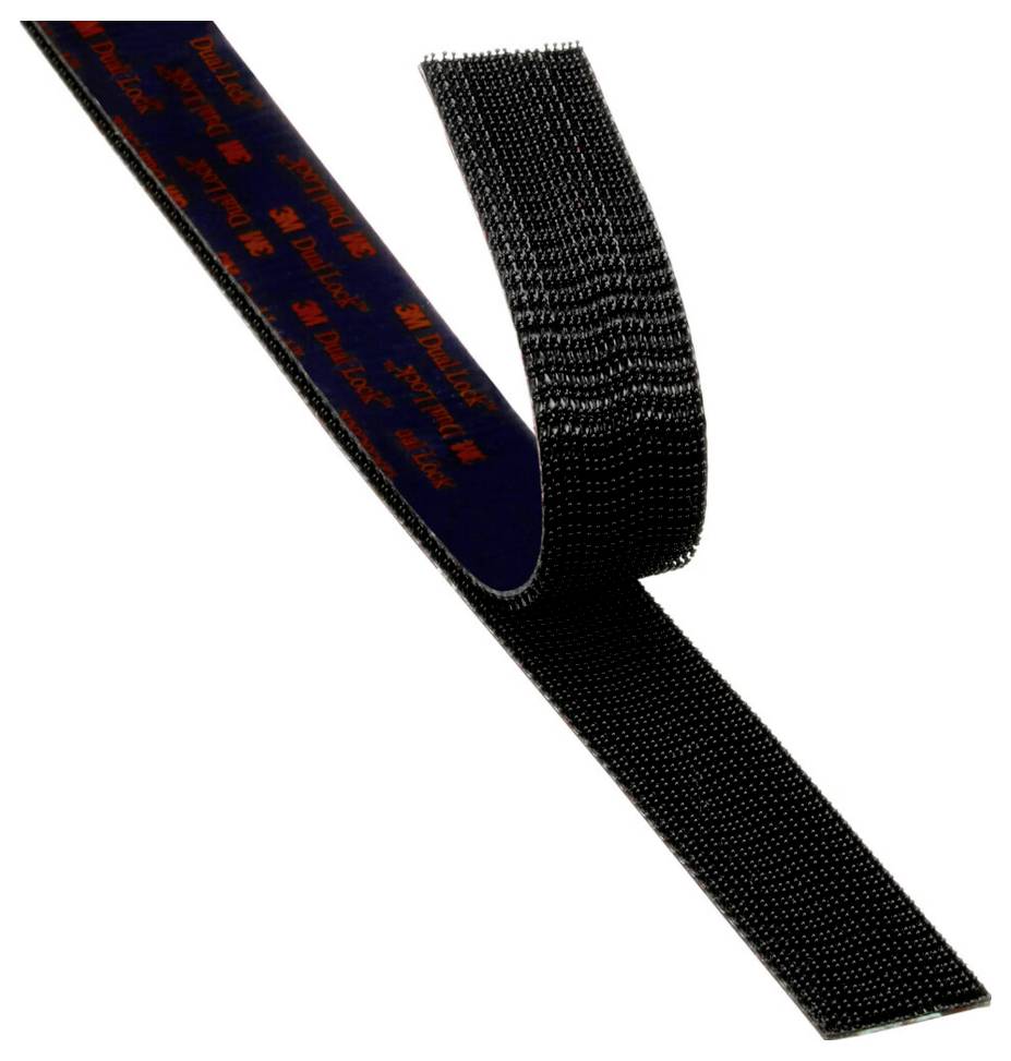 A black hook-and-loop fastener strip with the print '3M Dual Lock'. The strip is rolled up and shows the hook structure for fastening purposes.