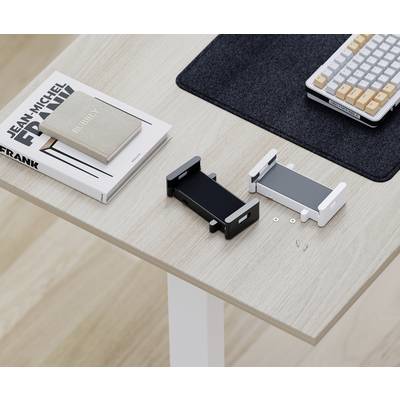 Books, smartphone holders and a keyboard on a light wooden desk. Workspace with modern accessories.