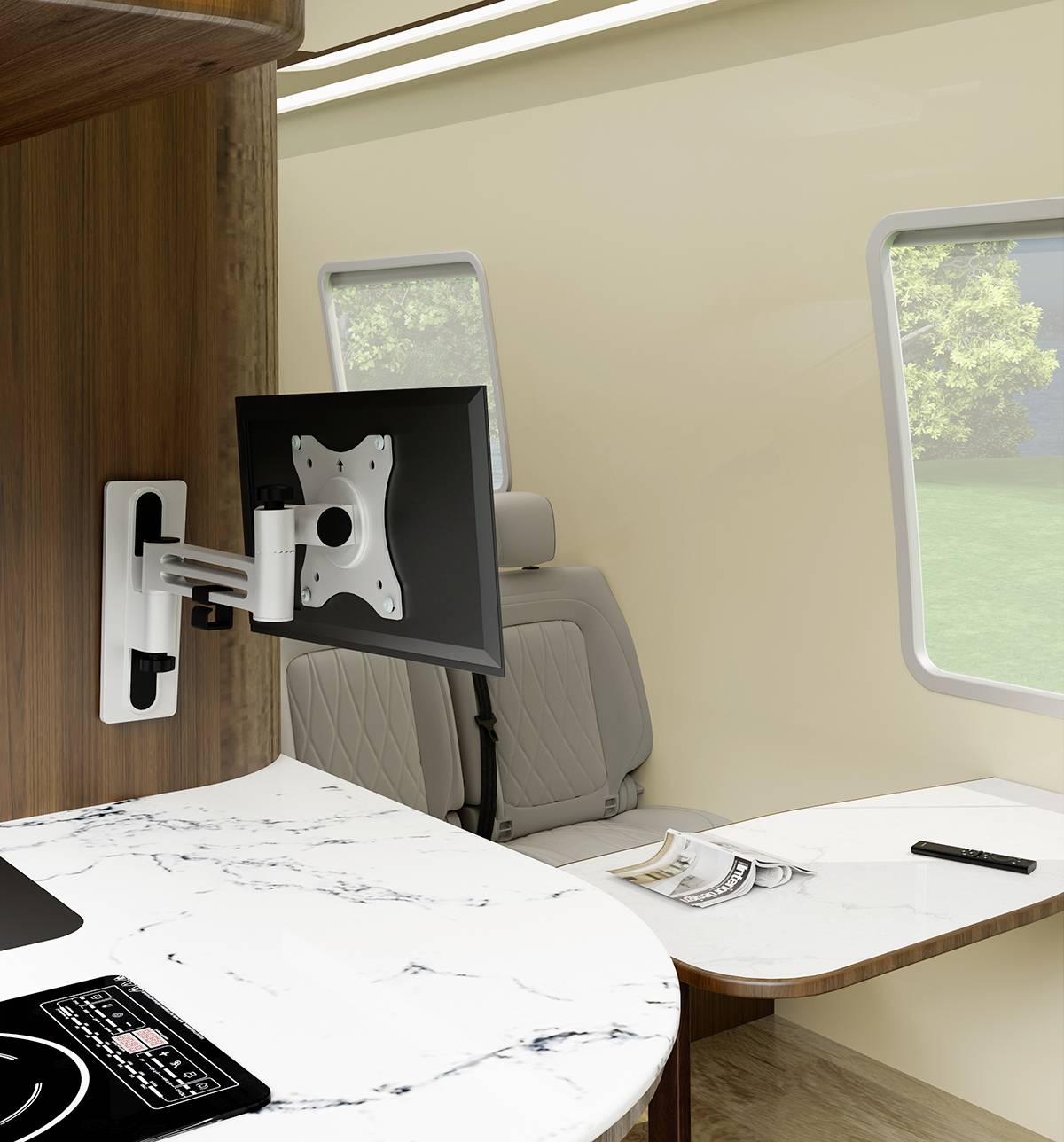 Interior of a campervan with modern design. A table with marble effect and a wall mount for a monitor are visible.