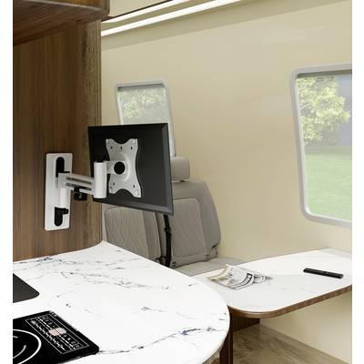 Interior of a campervan with modern design. A table with marble effect and a wall mount for a monitor are visible.