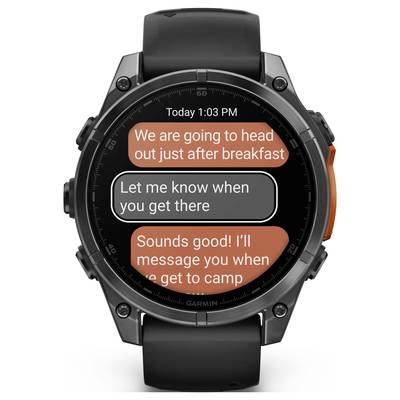Smartwatch with message display. Two people chatting: 'We'll head off after breakfast.' 'Let me know when you arrive.'