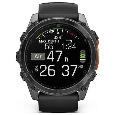 A diving watch with a black strap displays information such as maximum depth, current depth (47 ft) and remaining dive times.