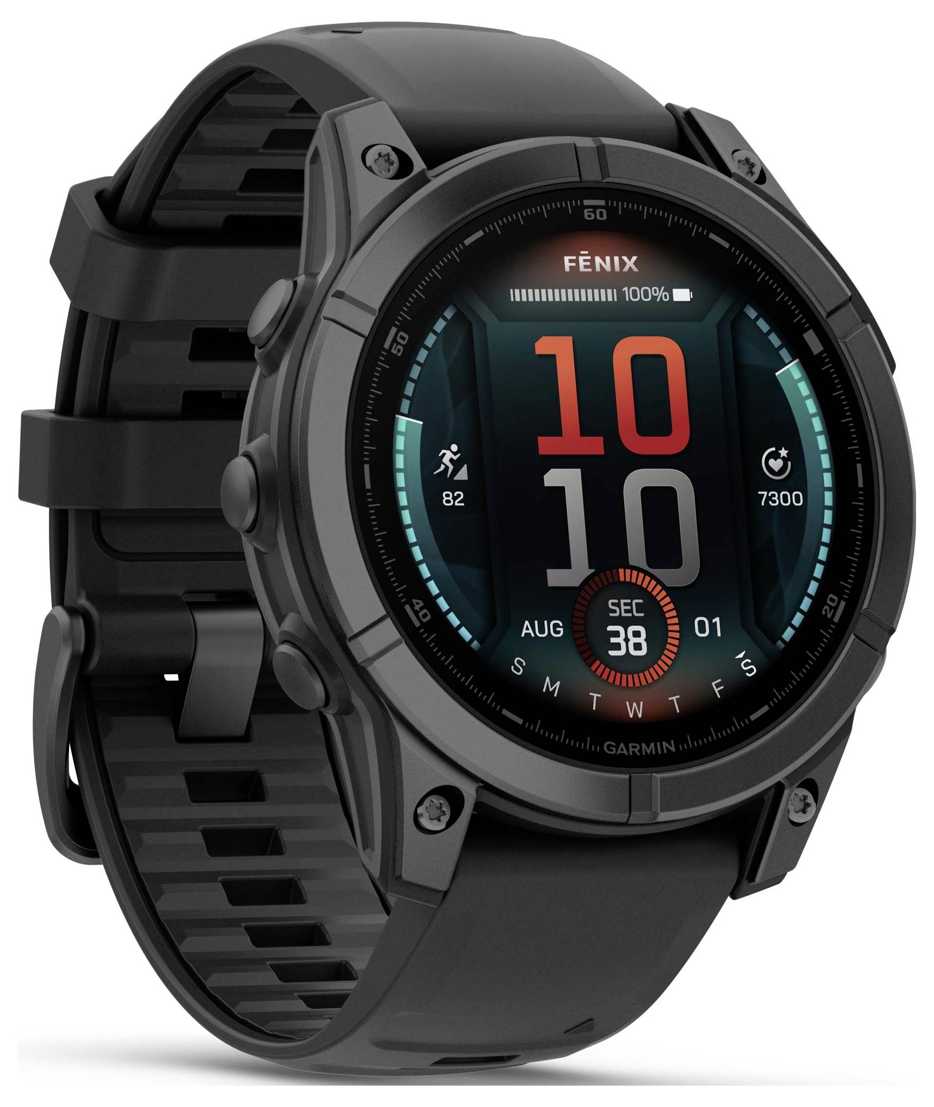 Black smartwatch with digital display. Shows time, date and icons for steps and heart rate.