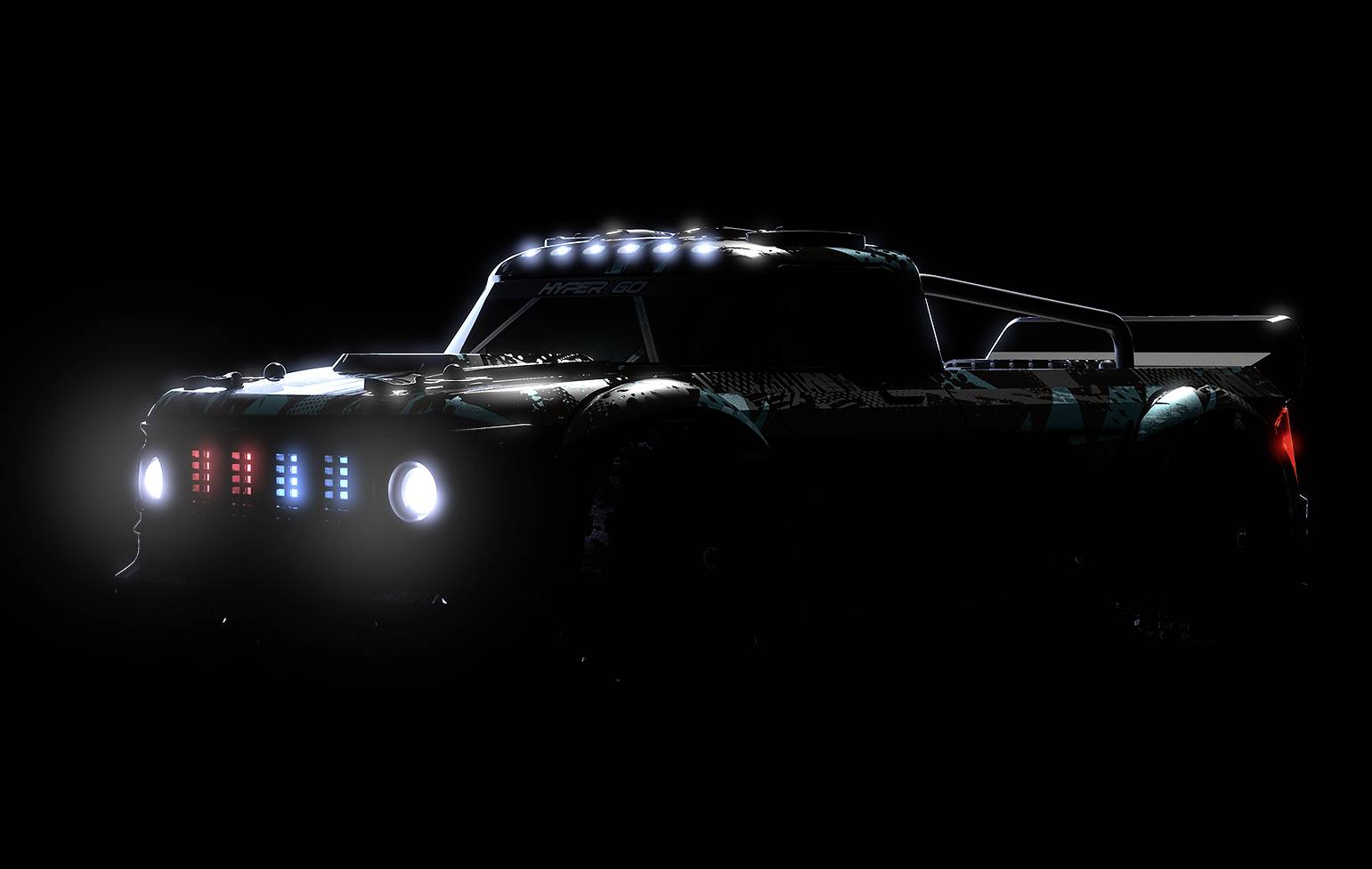 A car with illuminated headlights and blue and red lights on the front in the dark. The vehicle has a sporty design.