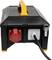Black portable power generator with an orange handle and an attached cable; suitable for outdoor or construction site use.