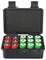 An open black suitcase contains eight red and eight green batteries, neatly arranged in two rows.