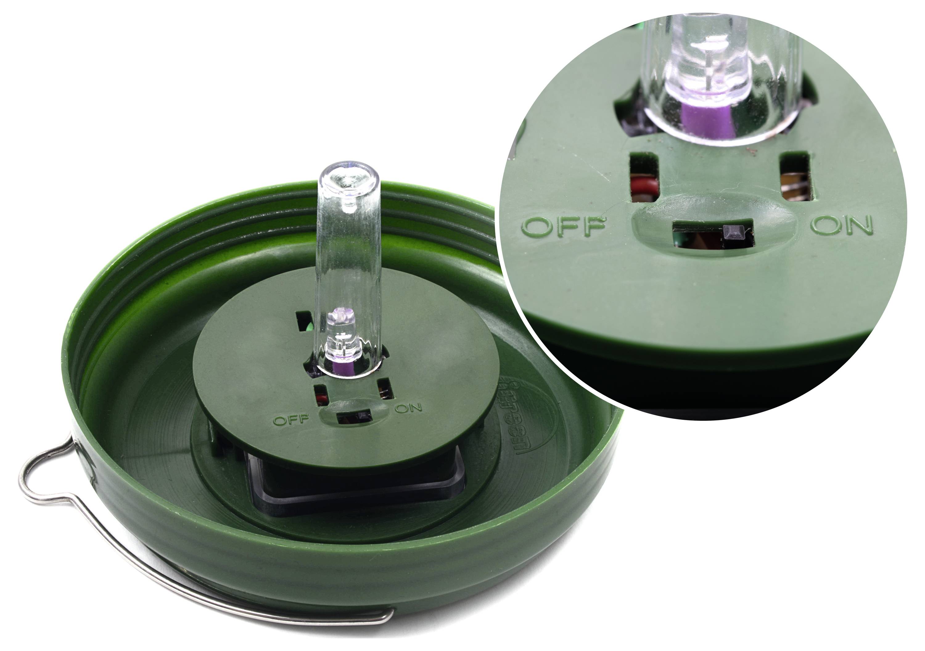 Green container with a central transparent rotary knob. The knob has two positions: 'OFF' and 'ON'.
