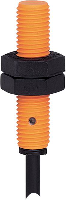Close-up of a black hexagonal nut pair with an orange plastic bolt visible through an opening in the middle.