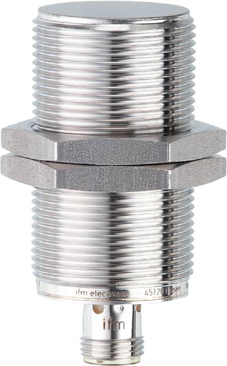Close-up of a cylindrical, metallic workpiece with a threaded screw, potentially a sensor.