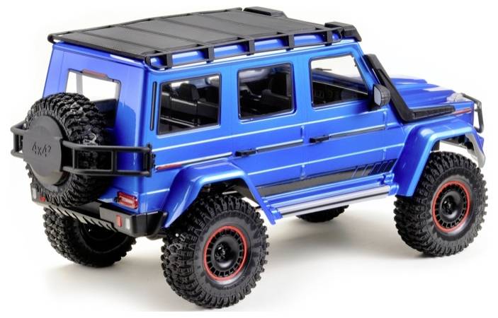 A blue model off-road vehicle with distinctive tyres and a spare wheel at the rear.