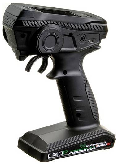 Black RC controller with handle and multiple buttons. Suspended button prominently displayed, showing technical design with carbon fibre elements.