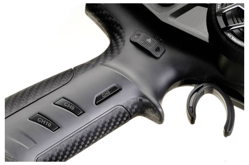 Close-up of a black remote control handle with buttons 'CH9', 'CH10', 'CH3' and a rotatable element. Suitable for model control.