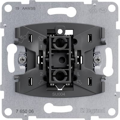 Metal switch frame with a grey plastic mounting bracket and visible screws. Markings for electrical connections are visible.