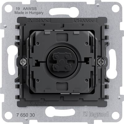 A black, rectangular press switch by Legrand, installed in a silver metal plate. Marking shows 'Made in Hungary'.