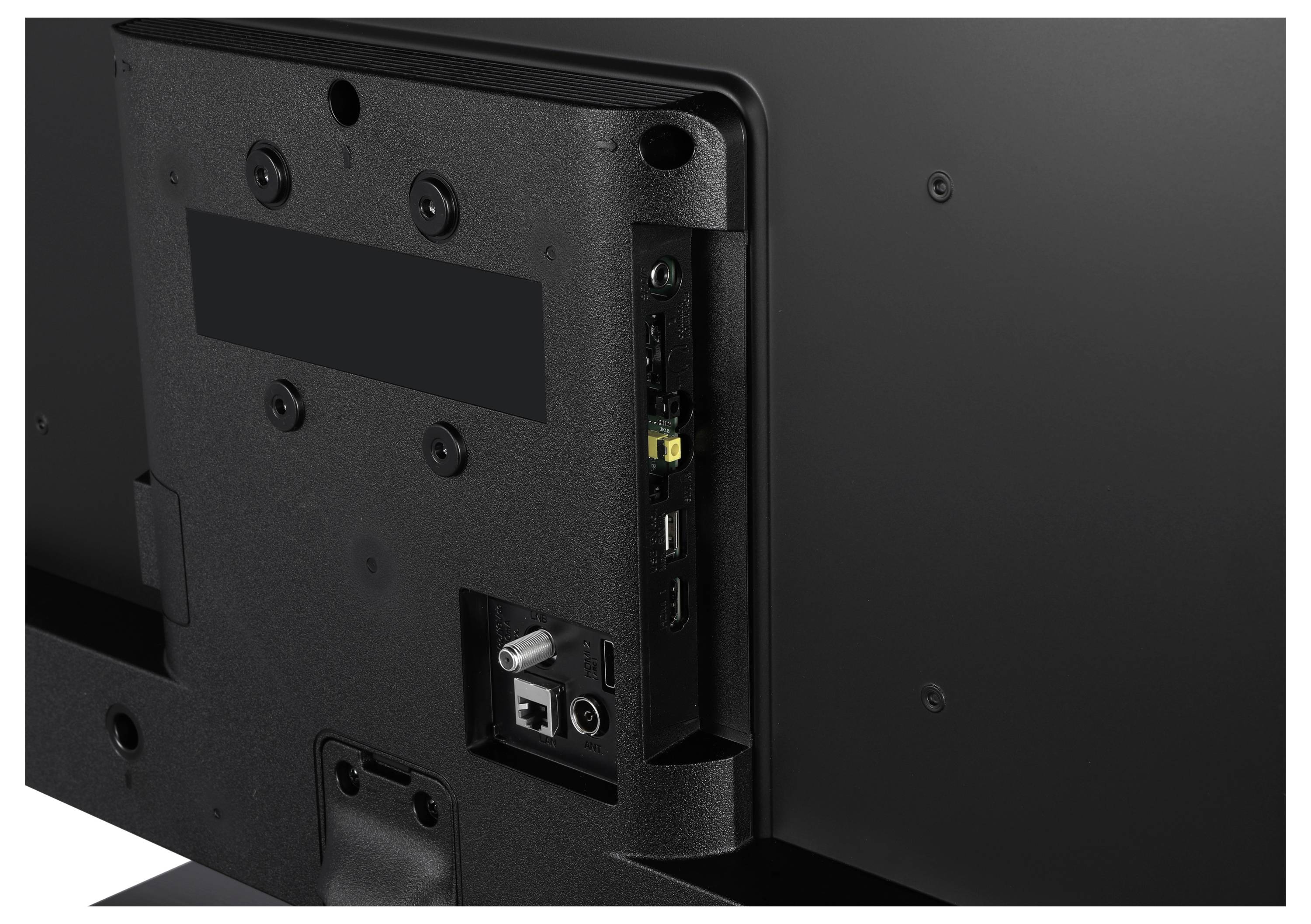 Rear view of a television with visible connections, including HDMI, USB and audio ports.