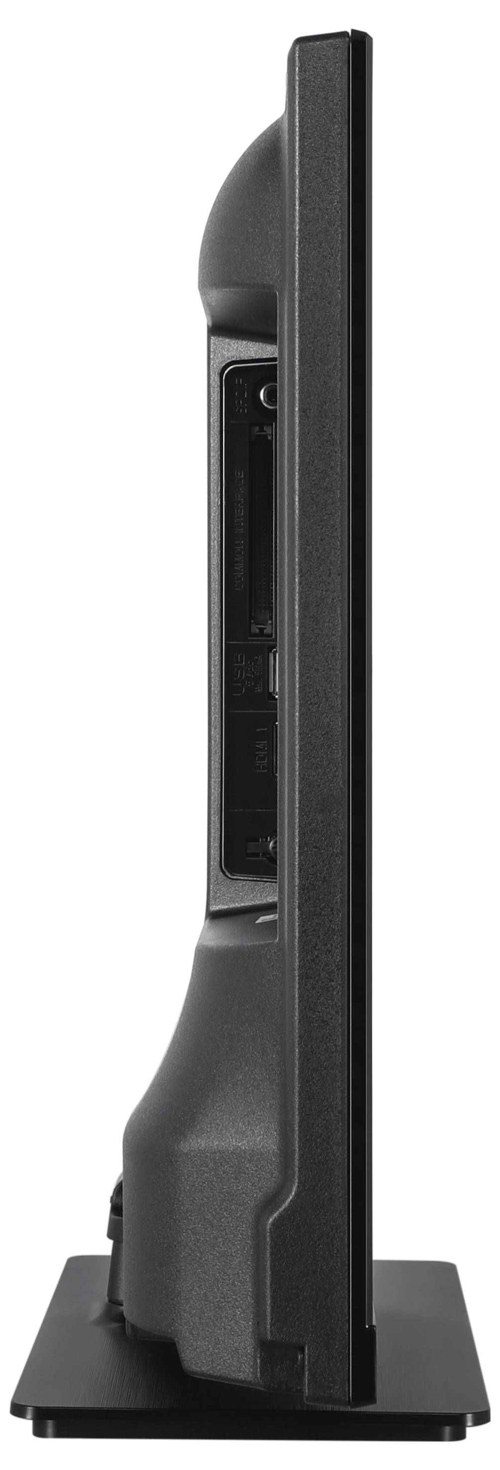 Side view of a flat-screen television with a slim bezel, showing the rear with connections. Device is standing vertically on a stand.