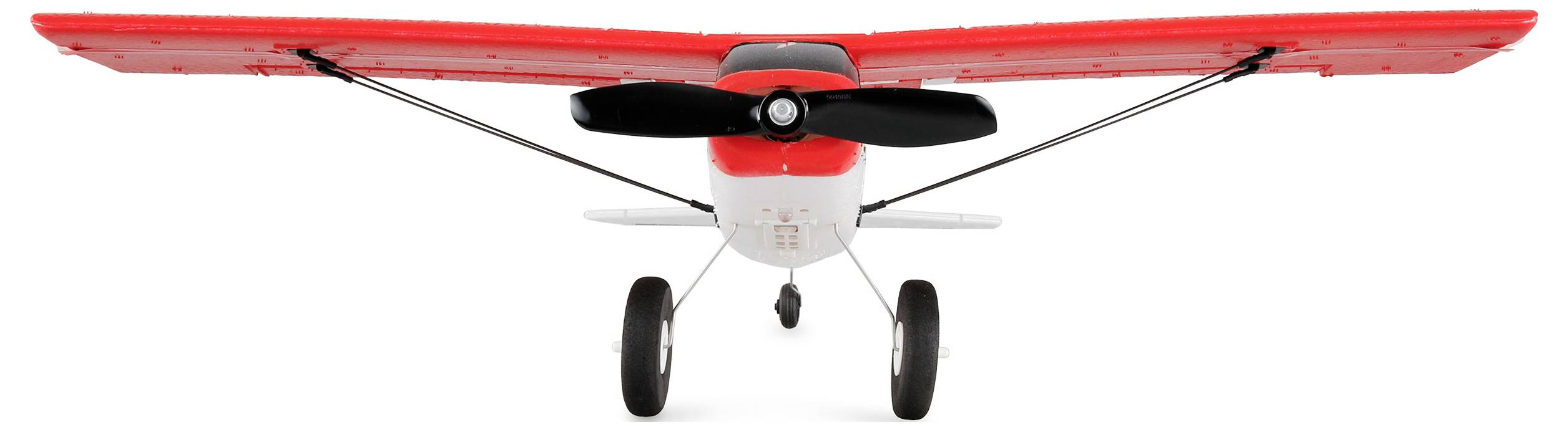 Toy aeroplane with a red fuselage and wings, black propeller and two wheels. Front view on a white background.