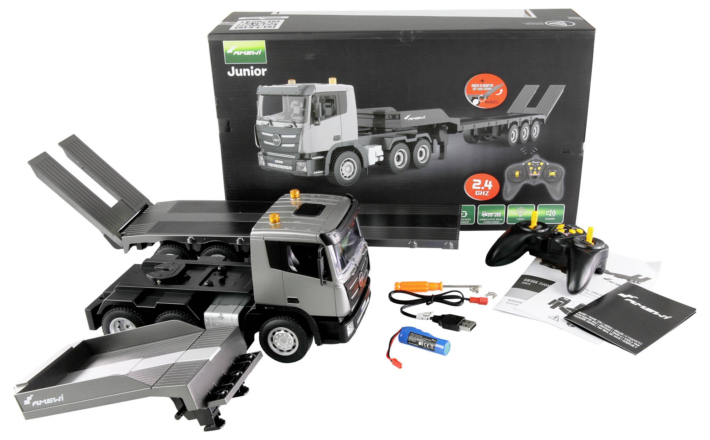 Remote-controlled toy lorry, charger, instruction manual, and packaging. The lorry has tipping load beds, is radio-controlled, and suitable for children.