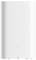 White, cylindrical electronic device with minimalist design and a button on the front. Possible air purifier.