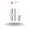 Two white, flat sensors with grooves in the centre, designed for door and window security. Xiaomi logo positioned centrally at the top.