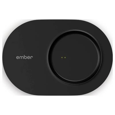 A black charging base with the inscription 'ember' to the left of a round recess showing two small contact points.