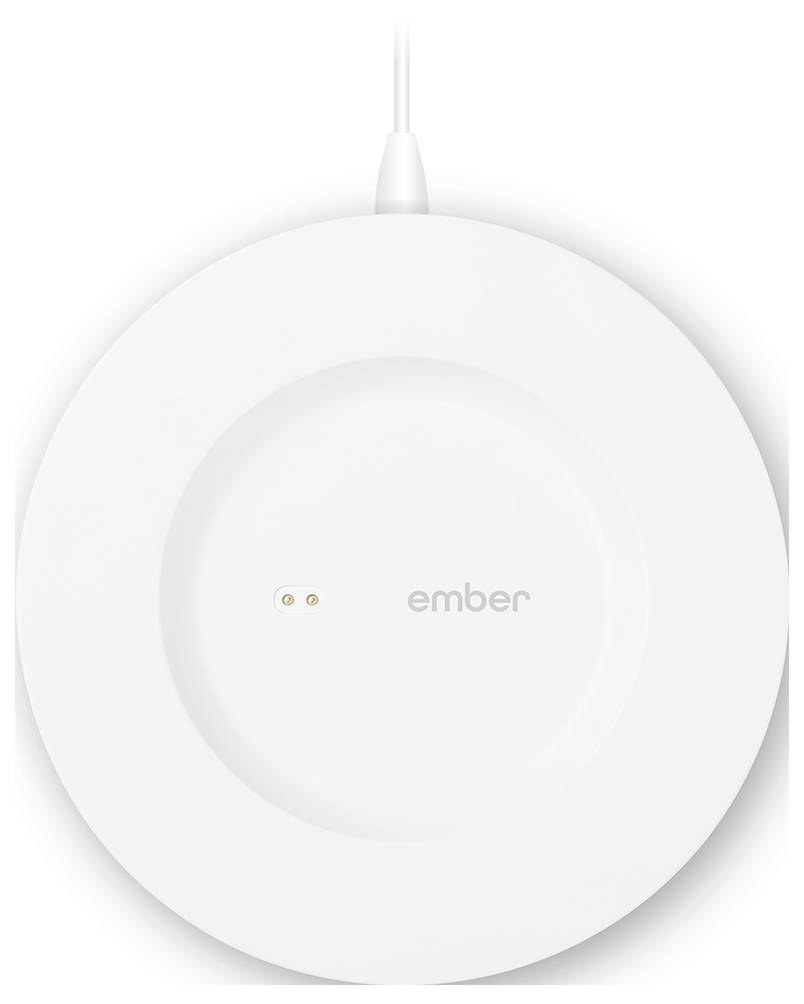 A round white charging pad with the 'ember' inscription in the centre, connected by a cable at the top.