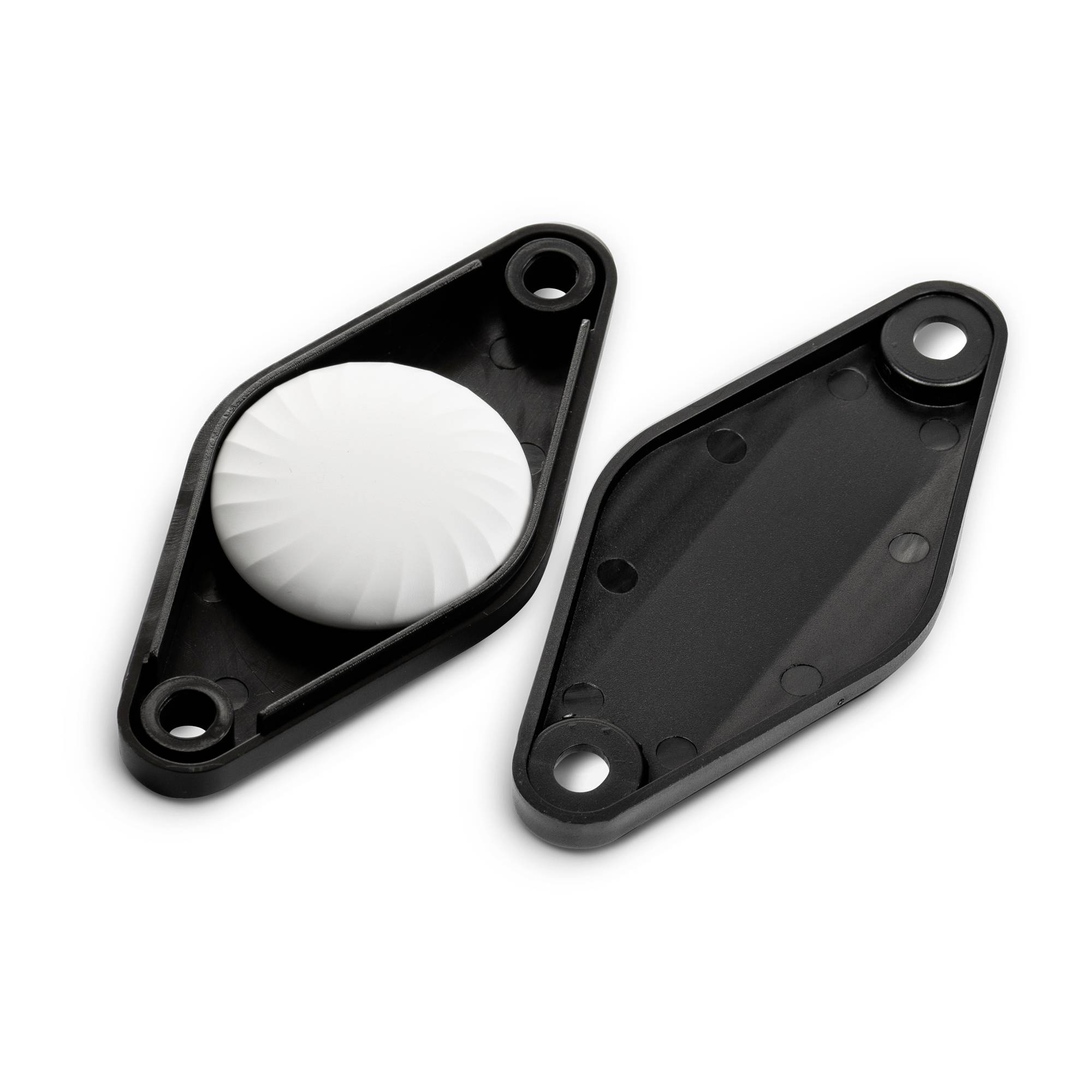 Two black plastic covers, one open with a white textured surface, the other closed, on a white background.