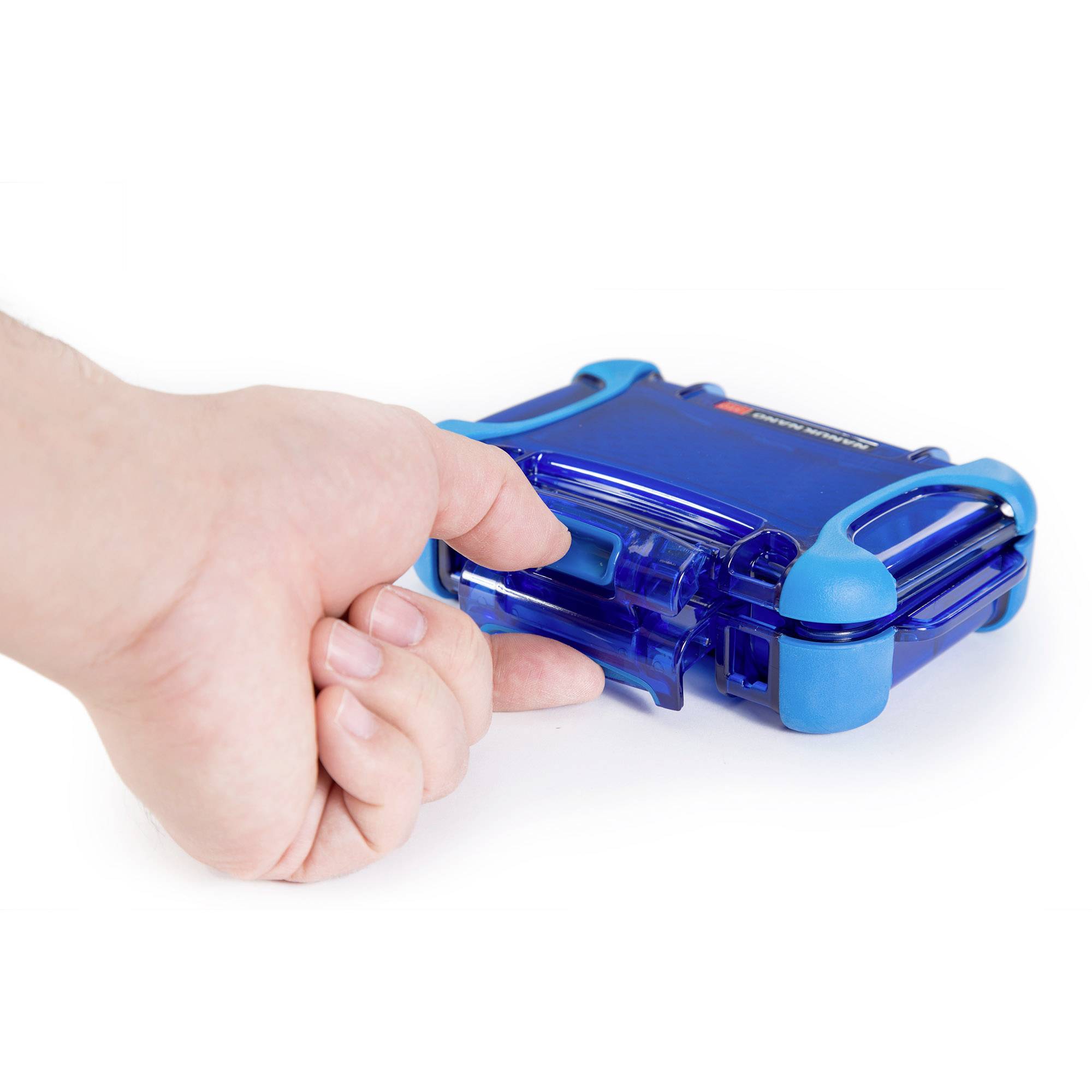 A hand is holding a blue, rectangular plastic device with rubber corners. The image illustrates the secure grip of the device.