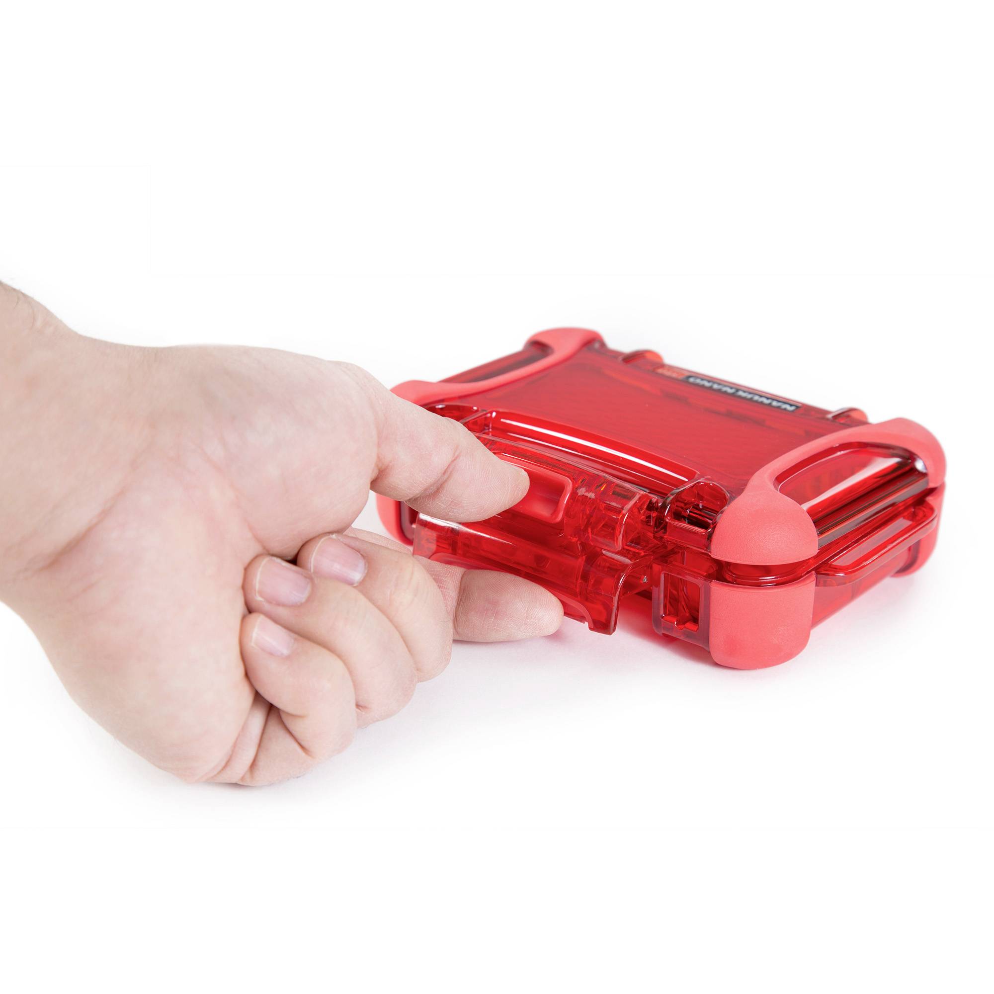 A hand presses on a red, transparent box, which is being closed.