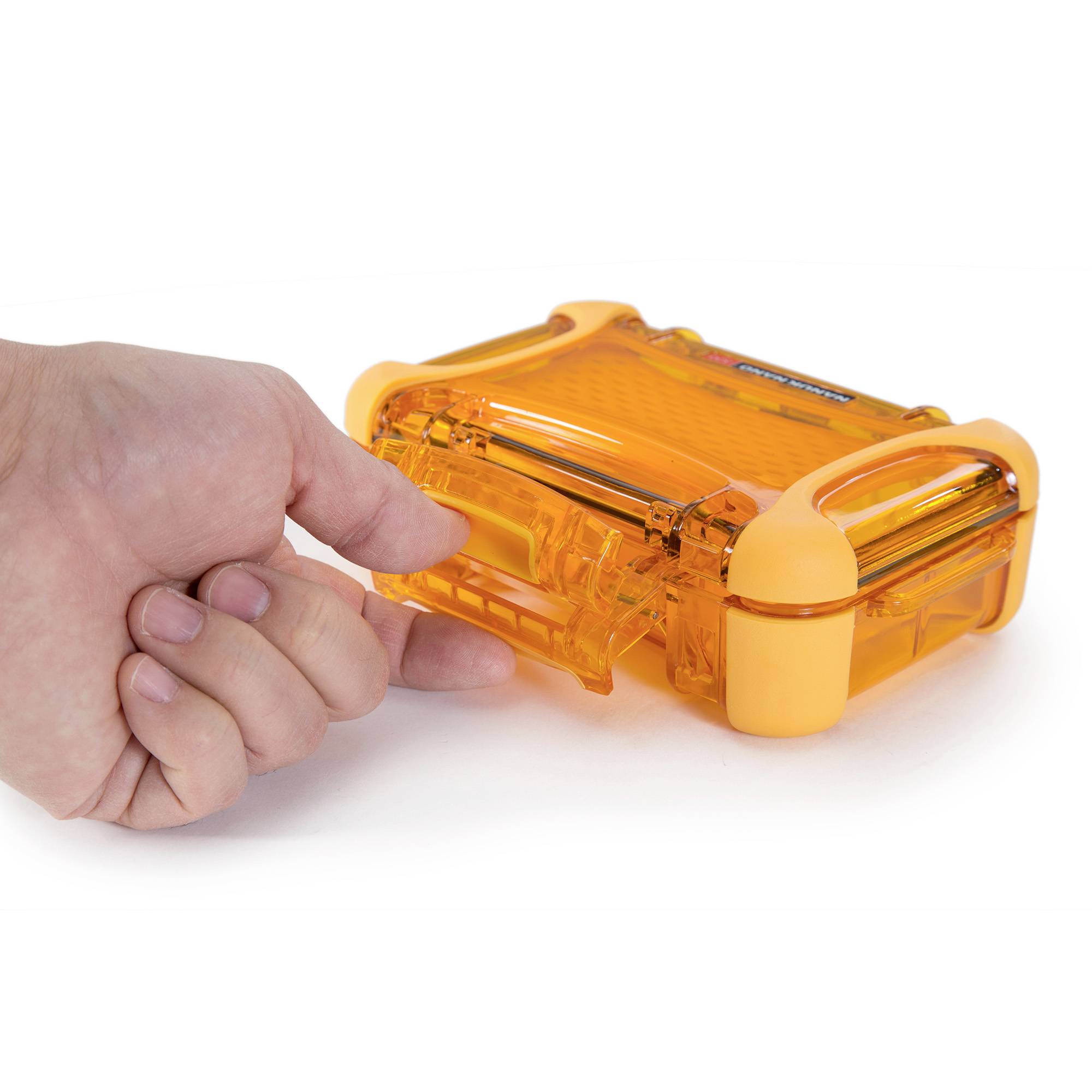 A hand opens a small, rectangular, transparent orange-coloured case with handles on both sides.