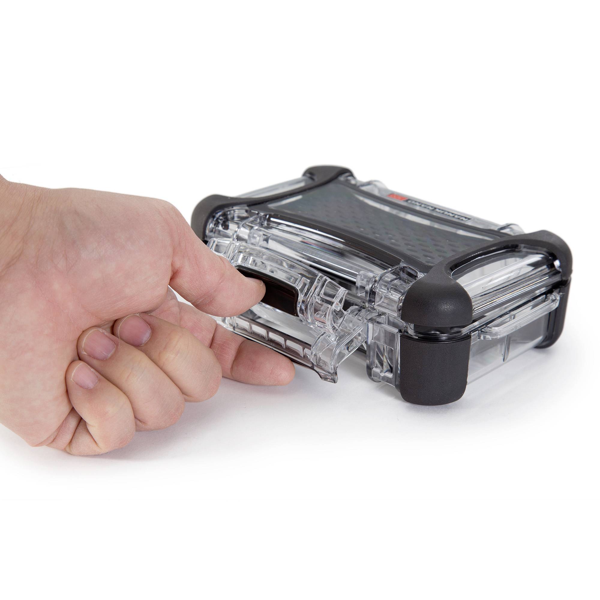 A hand opens a transparent, black plastic case with a snap fastener.