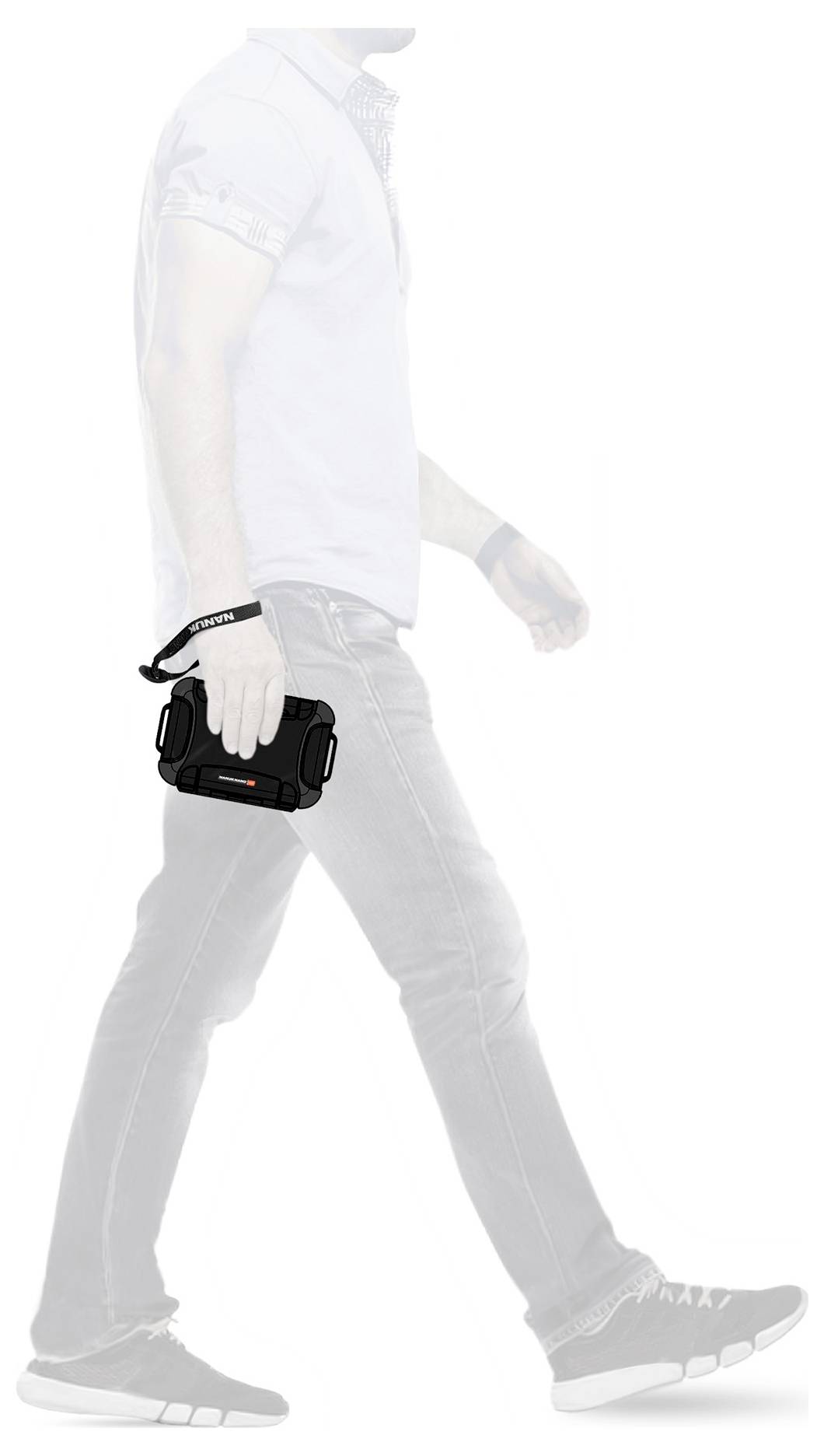 A person is carrying a camera in their right hand while walking. The camera has a black body and a shoulder strap.