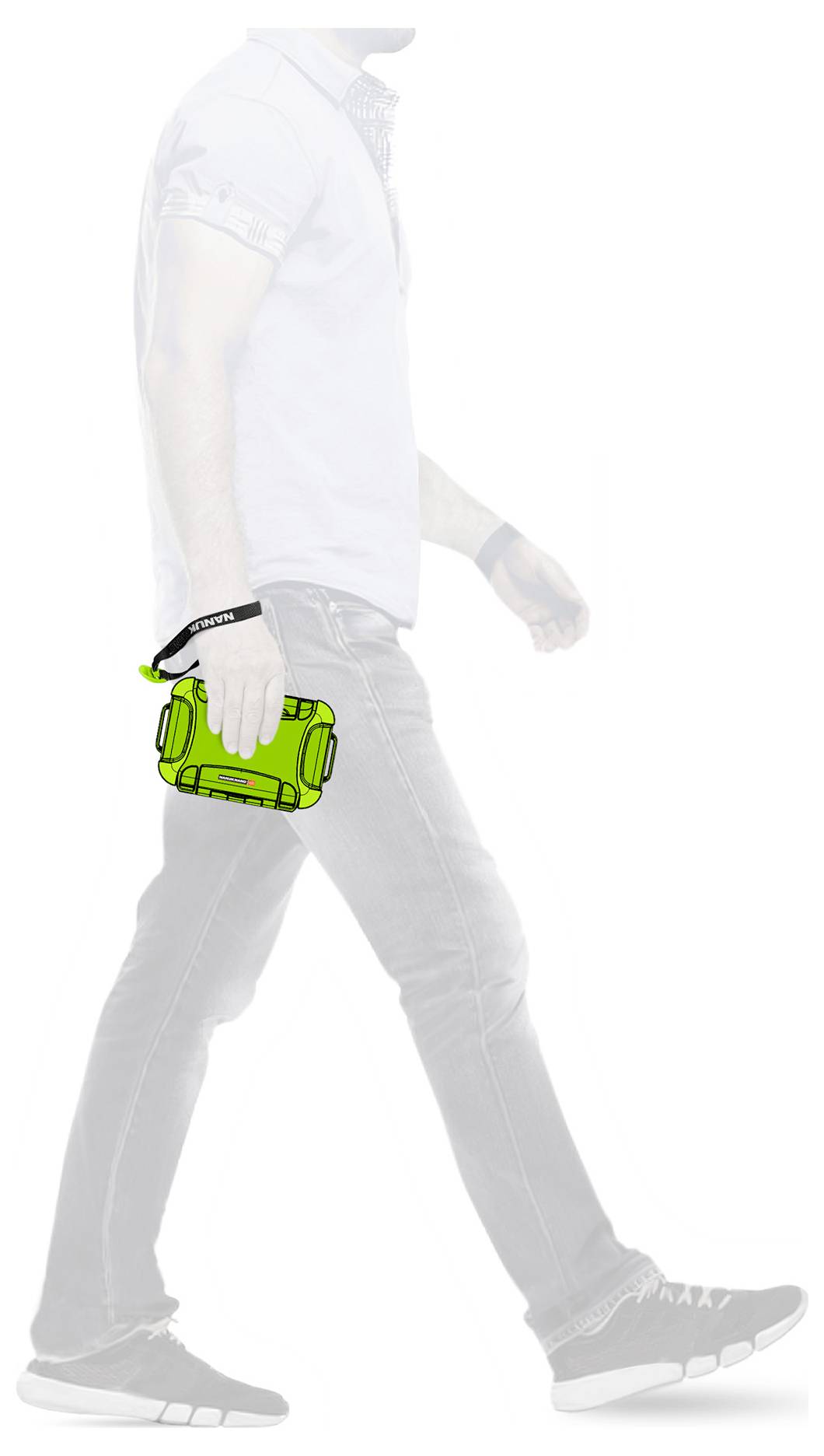 'A man walking holds a green portable speaker in his right hand.'